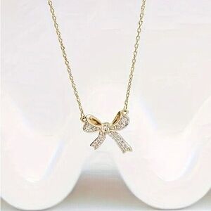 Gold bow necklace